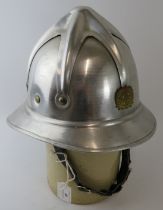 A 1970s Yugoslavia Fire Service polished aluminium fire helmet.