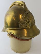 An early 20th century French Brass Fontenay Fire Service Sapeurs Pompiers fire helmet
