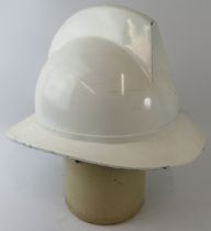 A 1970s white Belgian Fire Service fibreglass fire helmet