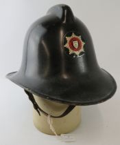 A British 1960s Derbyshire Fire Service fire helmet.