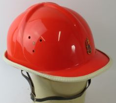 A 1970s West German Youth Fire Brigade orange ABS fire helmet.