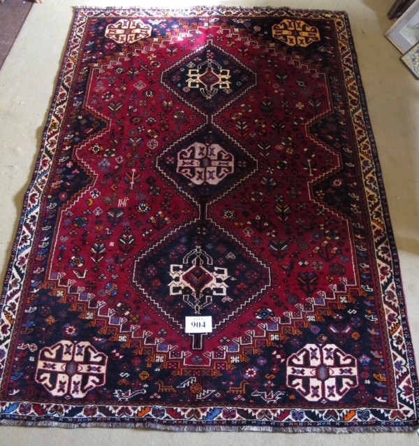 A fine South West Persian Qashqai rug. Three centred triangle motifs on red ground. 240cm x 165cm ( - Image 2 of 3
