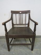 A Georgian elm & oak country elbow chair, the scrolled arms joined by turned uprights to the planked