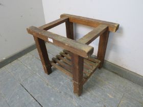 A vintage pine freestanding luggage rack, with slatted shelf below, on square supports. H43cm