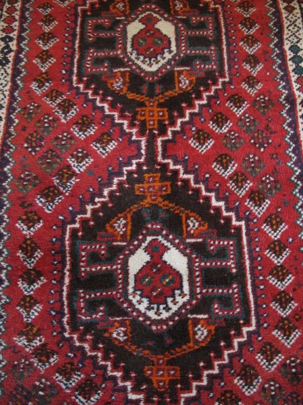 A mid 20th Century Turkish runner. Five central interlocking medallions on a red ground 290 x - Image 3 of 3