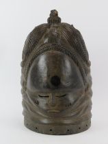 Tribal Art: An African carved and painted wood mask, Mende people, Sierra Leone. 34 cm height.