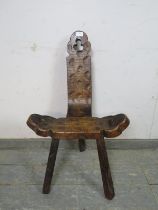 An unusual vintage Spanish Brutalist carved wooden chair, having pierced trefoil decoration, on