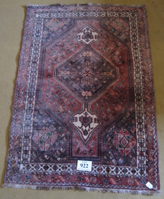 A 20th Century Qashqai rug. Central pointed medallion on a red/pink ground bordered in cream. 158 - Image 2 of 3