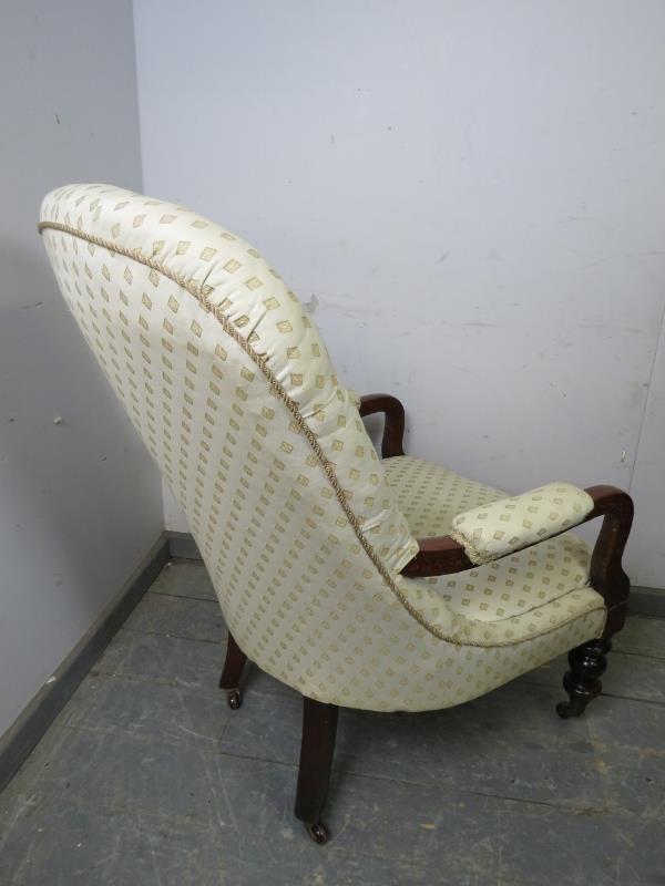 A Victorian mahogany open-sided button backed armchair, upholstered in patterned cream material, - Image 3 of 4