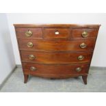 A George III mahogany bow-fronted chest strung with boxwood, housing three short above three long