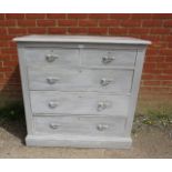 An oak chest, painted grey and distressed, housing two short above three long graduated