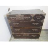 An antique Japanese Meiji Period ebonised metal bound tansu chest, housing two short above three