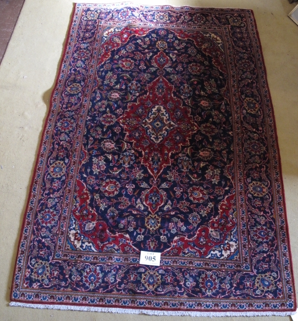 A central Persian Kashan rug. Typical Kashan with central motif. Red on blue ground. 230cm x - Image 2 of 3
