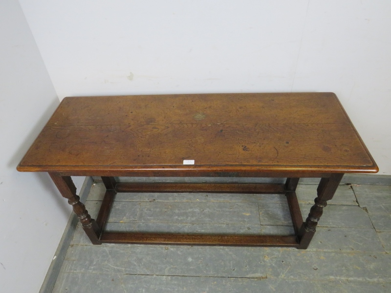 A 19th century oak serving table, on turned and block supports with stretchers. H68cm W129cm - Image 3 of 3