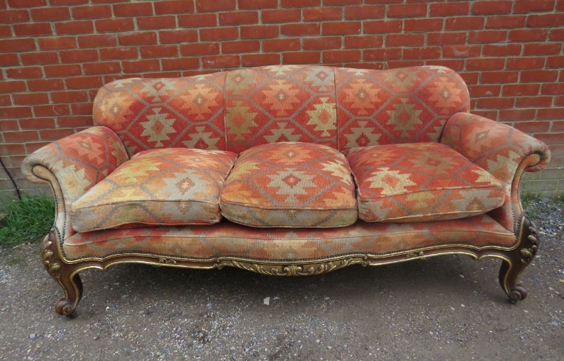 A 19th century serpentine fronted 3-seater sofa by Holland and sons, reupholstered in kilim style