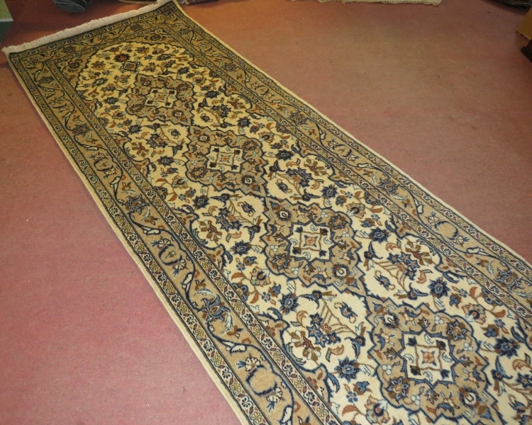 A central Persian Kashan runner, four central motifs on a cream ground. 300cm x 100cm (approx). - Image 3 of 3