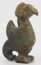 A Chinese archaistic jade carving of a zoomorphic creature. Formed as a bird with rams horns,