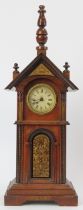 A novelty mahogany clock tower mantle clock, late 19th/early 20th century. Key included. 36.7 cm
