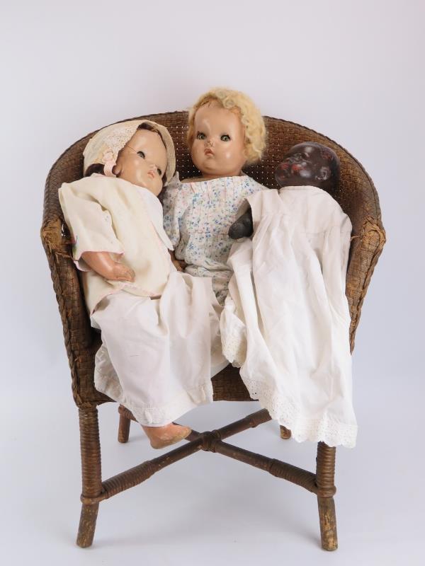 Three vintage dolls and a wicker chair. (4 items) Chair: 68.7 cm height. Condition report: Some