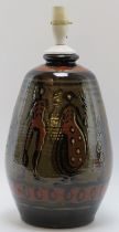 A European studio pottery table lamp, mid 20th century. Hand painted with a continuous scene