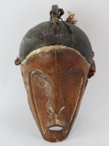 Tribal Art: An African carved and painted wood mask. 44.5 cm height. Condition report: Some age