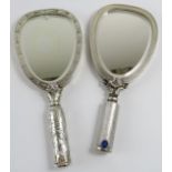 Two novelty Italian silver mirror shaped powder compacts with lipstick holder handles. Each