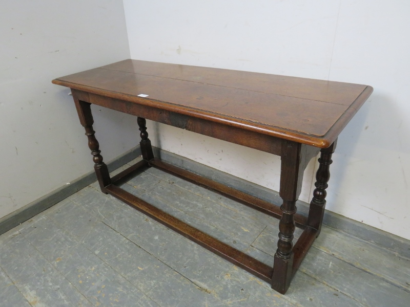 A 19th century oak serving table, on turned and block supports with stretchers. H68cm W129cm - Image 2 of 3