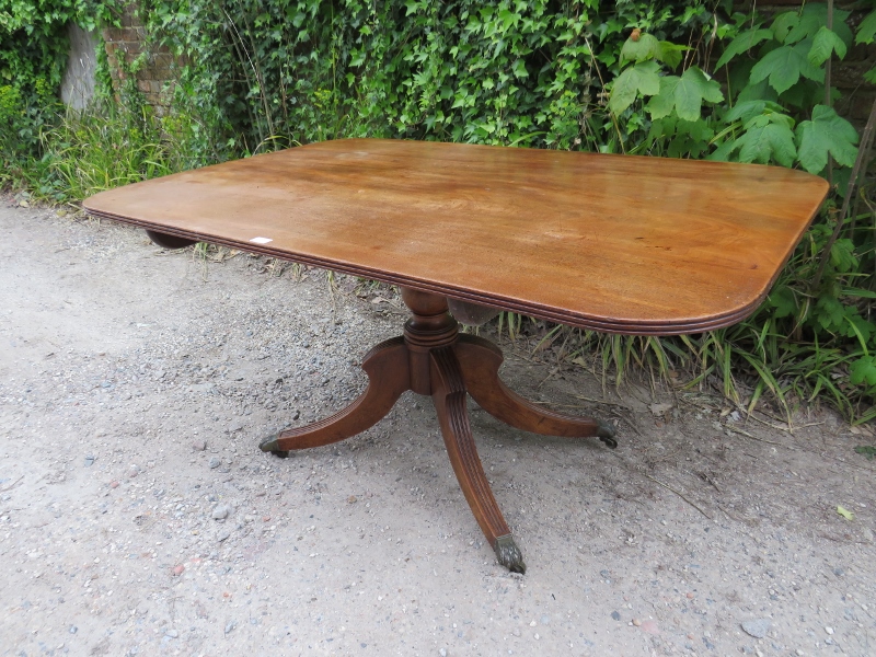 A Regency Period mahogany tilt-top breakfast table, the rectangular top with reeded edge, on a - Image 2 of 3