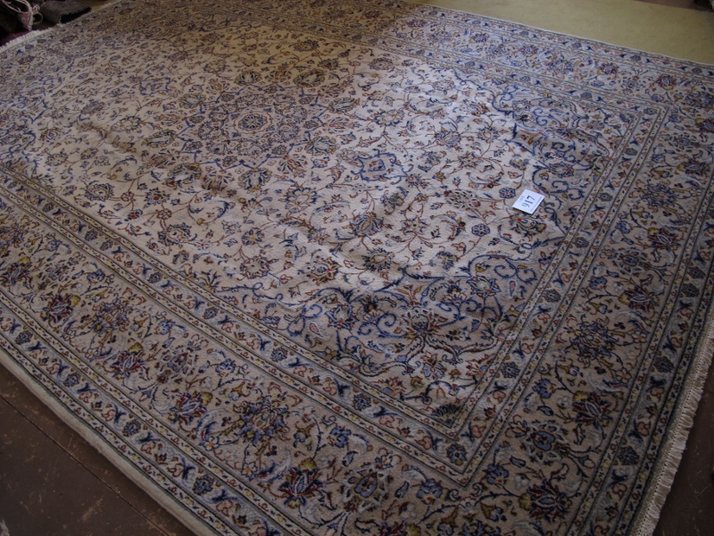 A fine central Persian Kashan carpet. A 16 point central motif on cream ground, surrounded by - Image 3 of 4