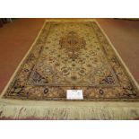 A Persian design rug, central motif, surrounded by repeat fawn, cream & brown. 176cm x 94cm (