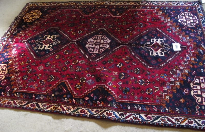 A fine South West Persian Qashqai rug. Three centred triangle motifs on red ground. 240cm x 165cm ( - Image 3 of 3