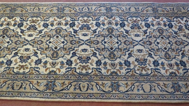 A central Persian Kashan runner, four central motifs on a cream ground. 300cm x 100cm (approx). - Image 2 of 3