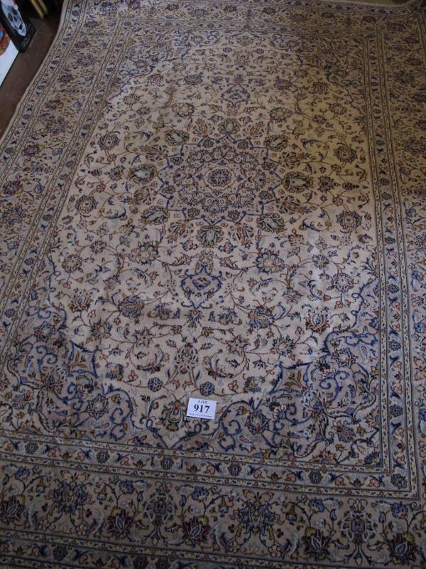 A fine central Persian Kashan carpet. A 16 point central motif on cream ground, surrounded by - Image 2 of 4