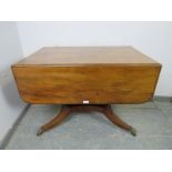 A good Regency Period mahogany Pembroke table, having long drawers to either end with pressed