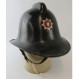 A British 1960s Derbyshire Fire Service fire helmet.