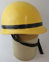 A late 20th century Goa Fire Service yellow fibreglass fire helmet with Concord Arai label