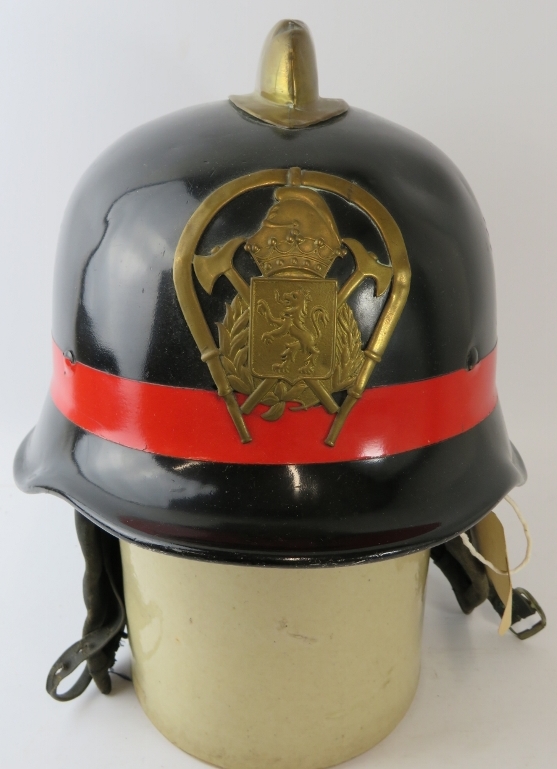 A 1970s Spanish Fire Service black steel fire helmet with brass comb and badge - Image 2 of 3