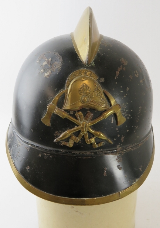 A 1930s German black and brass fire helmet with crossed axe badge - Image 3 of 4