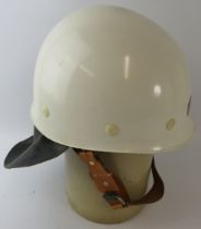 A 1980s Czechoslovakia Fire Service white ABS fire helmet with leather neck cowl