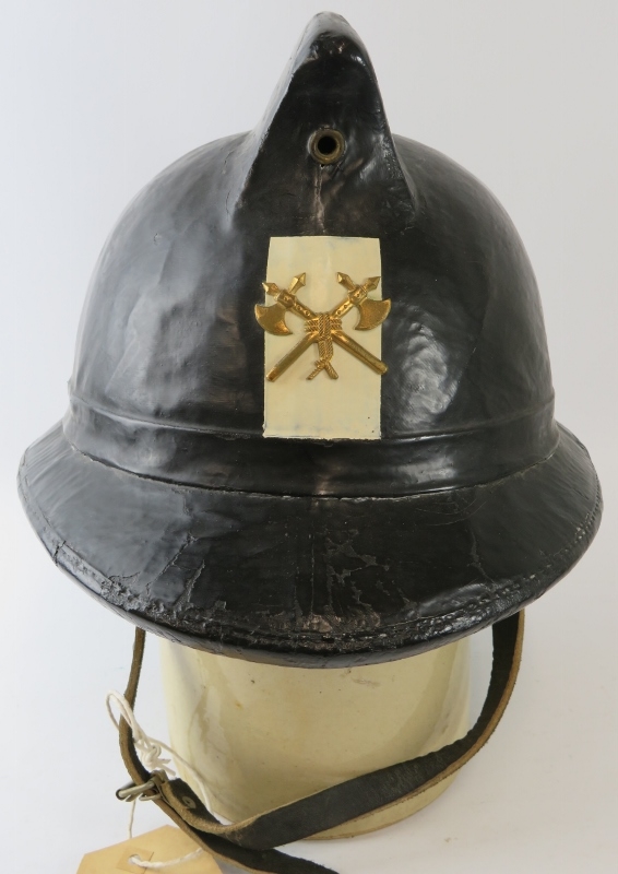 A 1970s Belgian Fire Service black cork fire helmet with brass badge. - Image 2 of 3