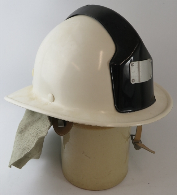 A 1990s Czechoslovakia Fire Service white Ergon fibreglass fire helmet with leather neck cowl