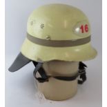 A 1970s West German Hamburg (16) Fire Service white steel helmet with leather neck cowl.