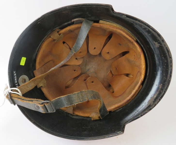 A 1950s West German red steel fire helmet with side mounted badge - Image 4 of 4