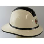 A 1980s Welsh South Glamorgan Fire Brigade white fire helmet.