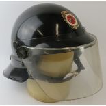 A 1980s Panama Fire Service black ABS fire helmet with visor