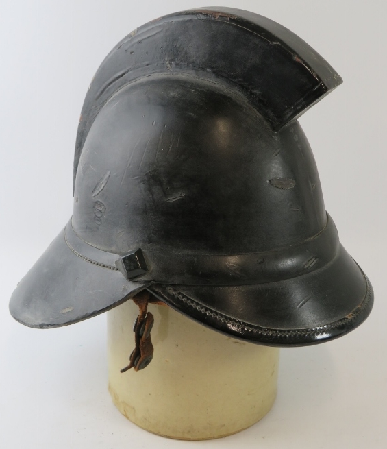 A 1920s British leather Hendry fire helmet with square comb