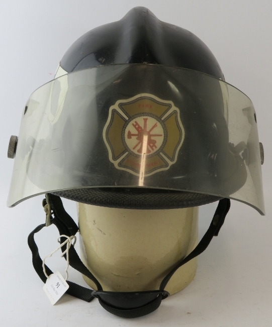 A 1980s US Newark Delaware Fire Department Cairns & Brother Inc black ABS fire helmet with visor - Image 2 of 4