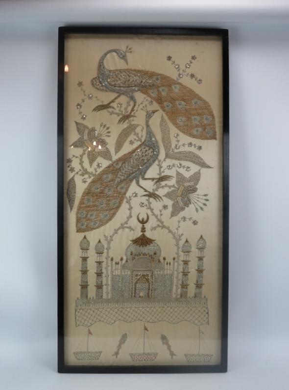 A large late 19th Century Indian silk work in silver and gold thread, of the Taj Mahal below two