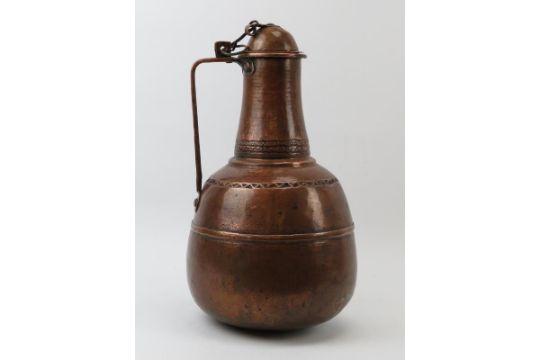 A large Moroccan copper decanter jug, probably 18th/19th century. 42 cm height. Condition report: - Image 2 of 4