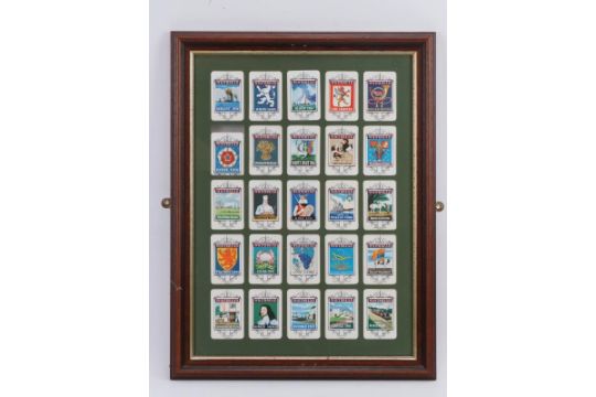 A framed set of twenty five Whitbread Inn tin pub signs. 46 cm x 33.5 cm Condition report: Light age